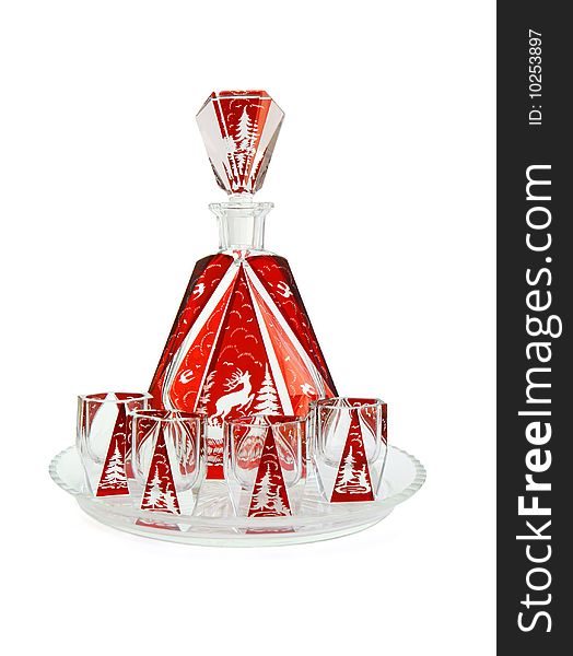 Red crystal carafe and liqueur-glasses on round plate isolated on white background