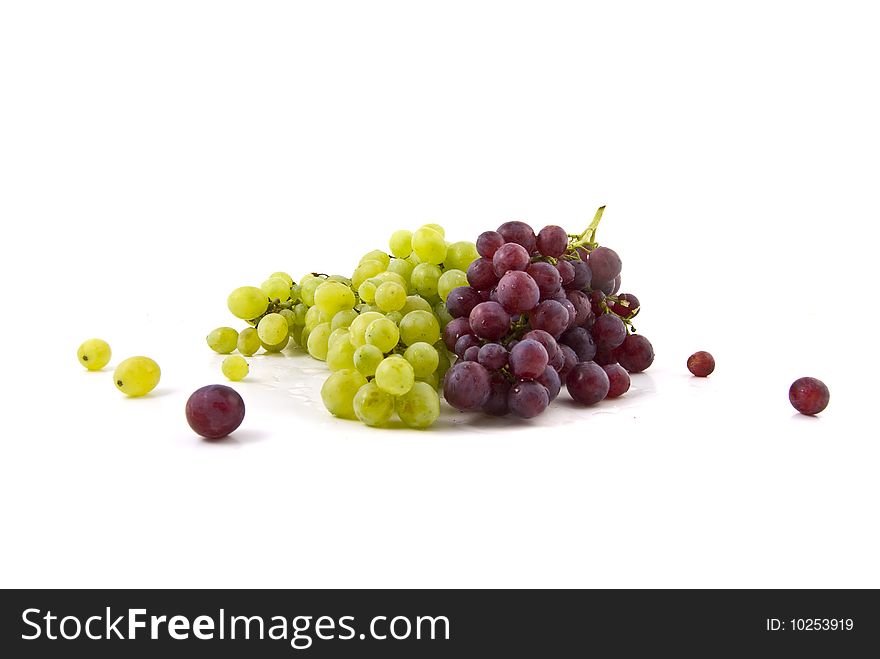 Both green and red grapes on white background. Both green and red grapes on white background