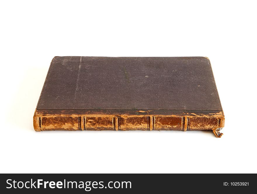 Antique book lies isolated on white background