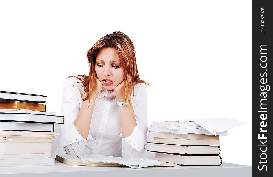 Worried attractive girl between lot of books. Worried attractive girl between lot of books