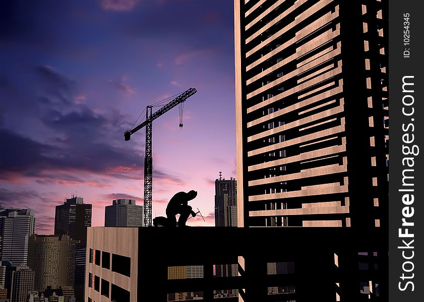 Silhouette of the worker on a background of the sky