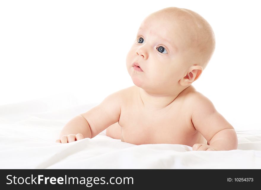 Cute baby boy on white blanket