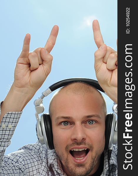 Disc jockey with headphones and arms up. Disc jockey with headphones and arms up