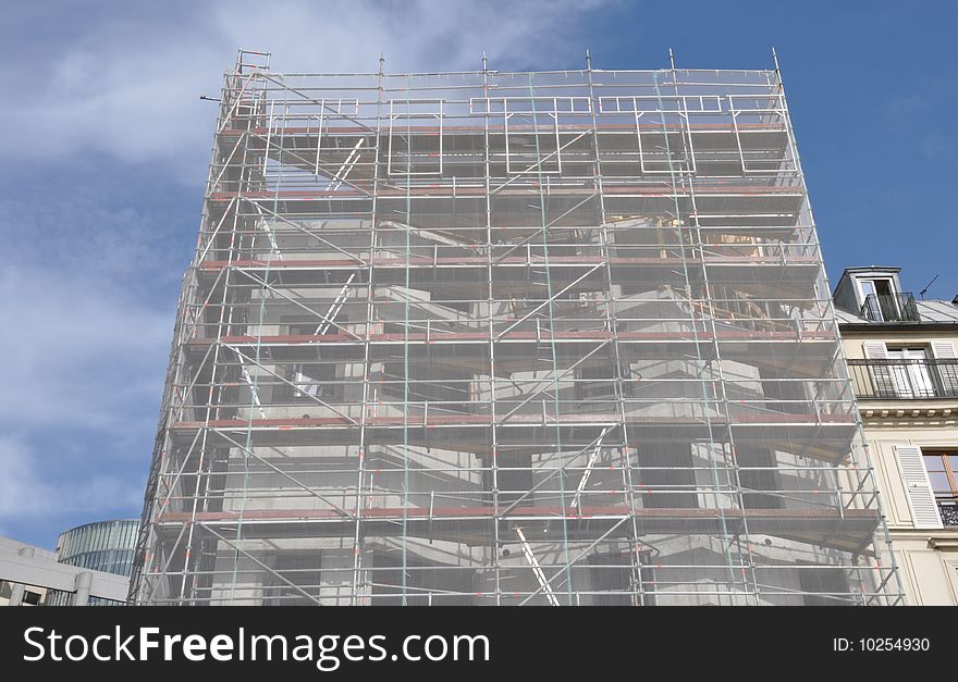 A scaffold hidding a modern building