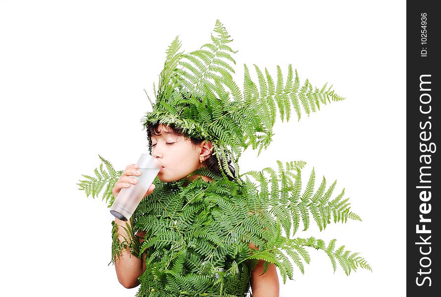 Pretty little girl dressed in green plant leafs