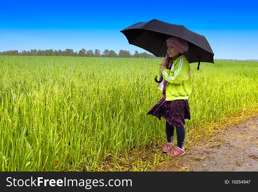 The lonely girl on a farmer field