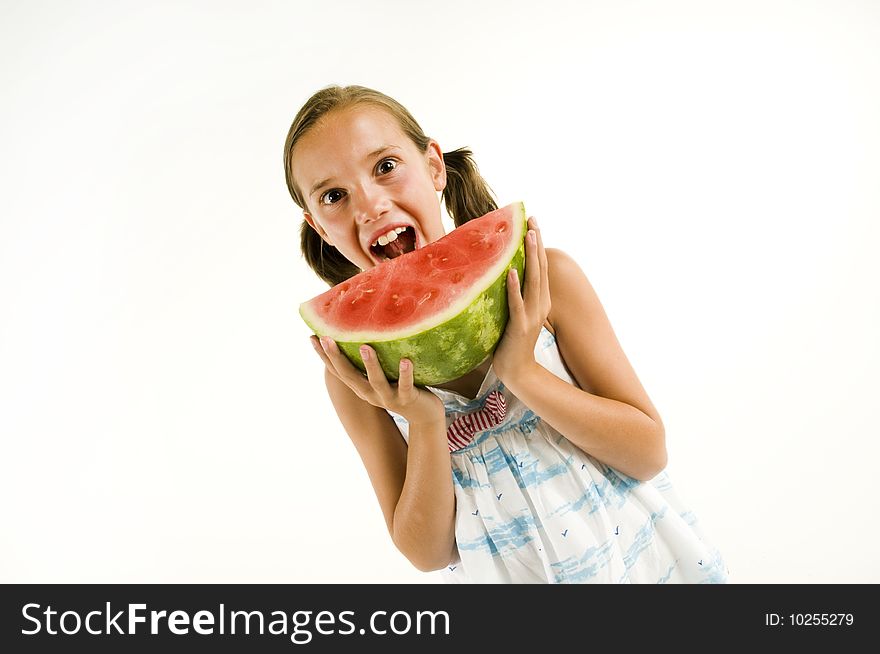 Young girl eating a watermelon