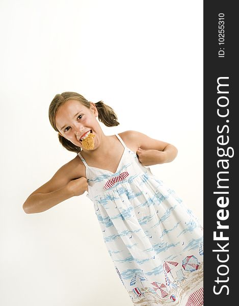 Young girl acting like a chicked while eating a chicken finger. Young girl acting like a chicked while eating a chicken finger