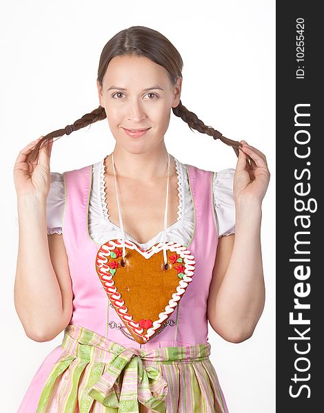 A young woman dressed in a traditional Bavarian Dirndl. A young woman dressed in a traditional Bavarian Dirndl.
