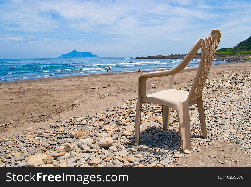 ONE OLD CHAIR ON THE BEACH. ONE OLD CHAIR ON THE BEACH