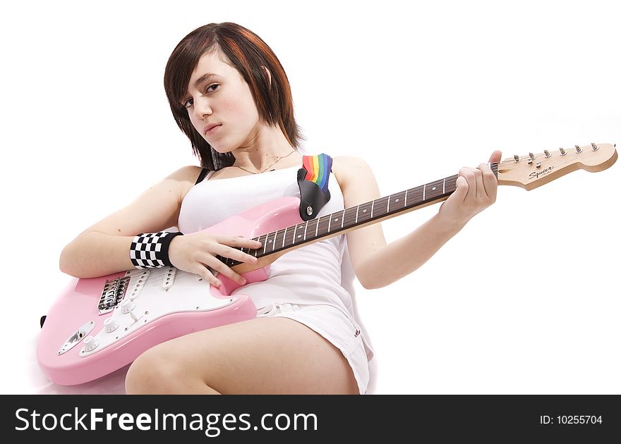 Young girl playing a guitar. Young girl playing a guitar