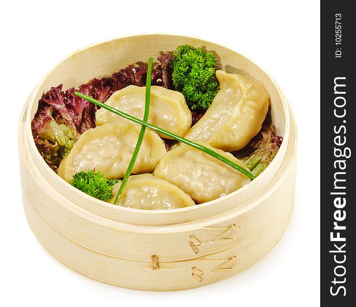 Japanese Cuisine - Pork Dumplings in Bast Basket with Salad Leaf