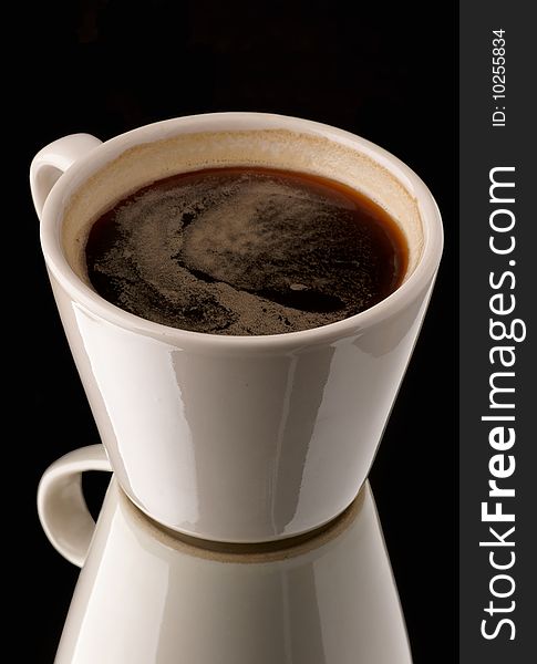 Cup from coffee on a black background