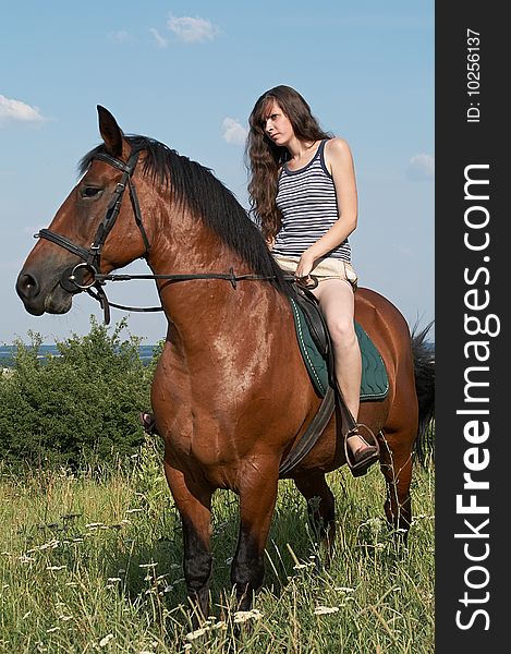 Girl Sits On Horseback