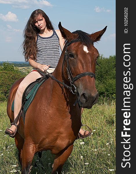 Girl Sits On Horseback