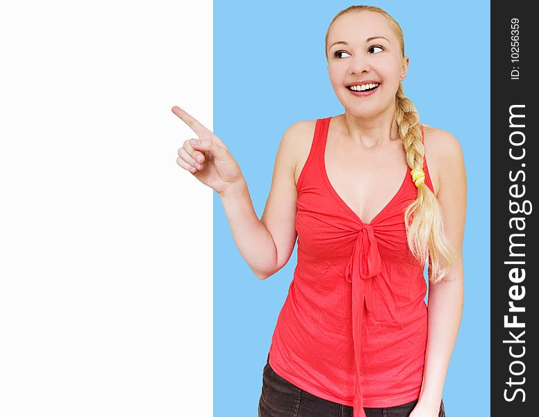 Smiling Woman Pointing Towards Copyspace