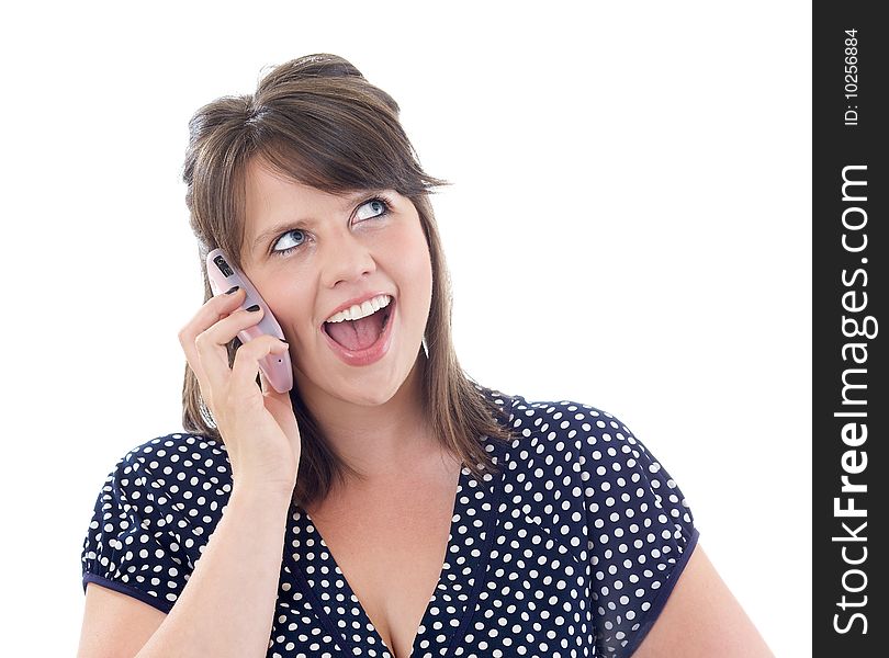 Happy young woman on her cell phone; isolated on a white background.