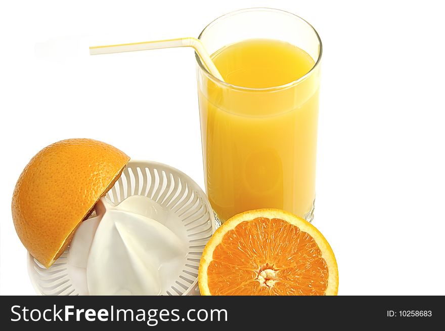 Juicer with slices of orange and glass of fresh juice isolated over white. Juicer with slices of orange and glass of fresh juice isolated over white.