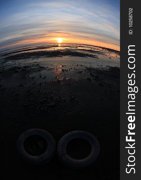 Sunset on the sea shore, fisheye distortion