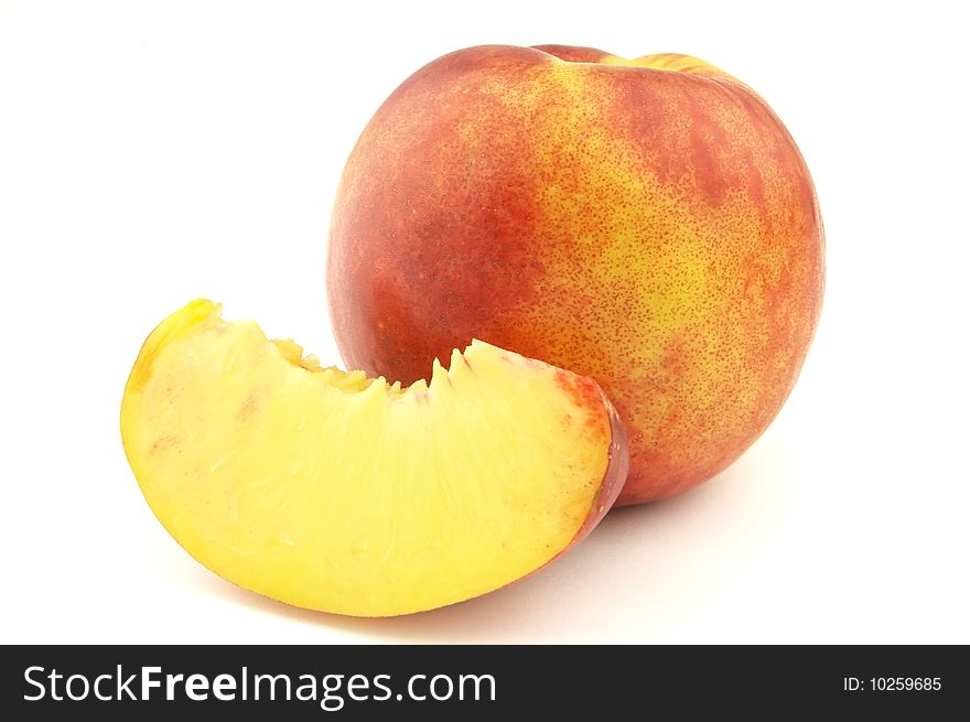 Cut peach on a white background. Cut peach on a white background