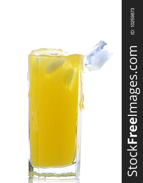 Glass of cold orange juice with ices