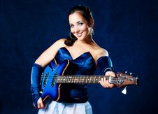 Sexy Girl Playing The Guitar Royalty Free Stock Image