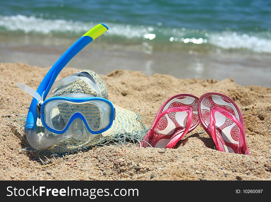 Beach accesories on the sand. Beach accesories on the sand