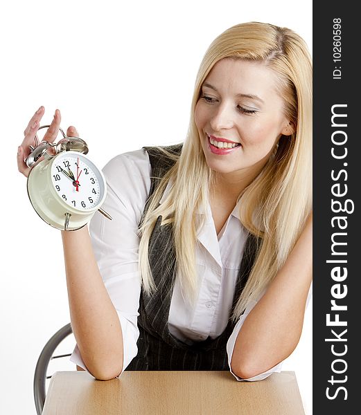 Portrait of businesswoman with an alarm clock