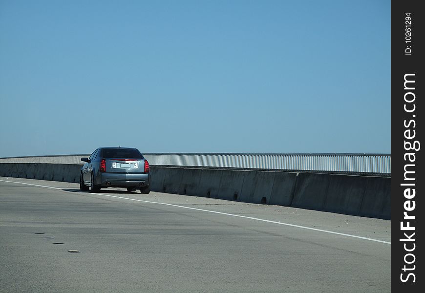 Modern sedan broken down on side of roadway