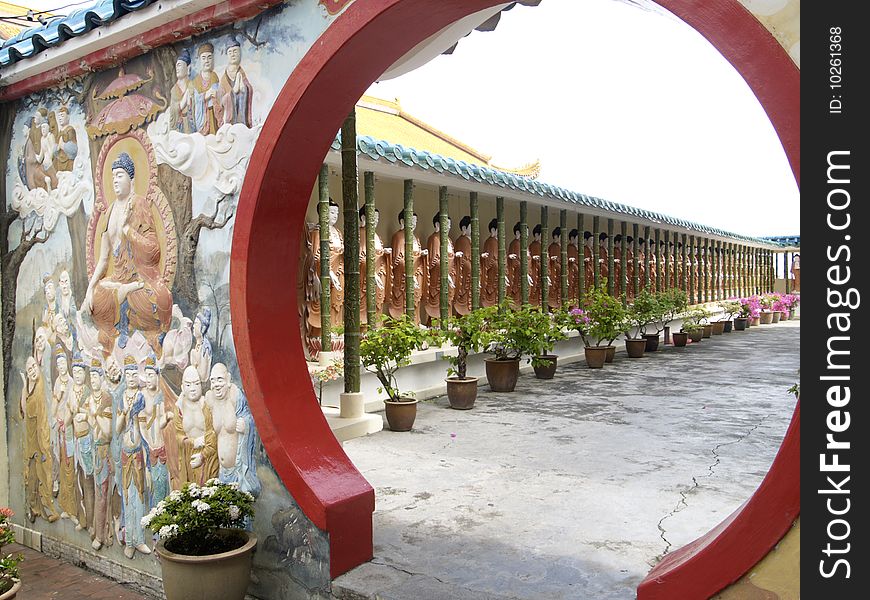 Long row of Buddha images at the Kek Lok Si temple in Penang, Malaysia. Long row of Buddha images at the Kek Lok Si temple in Penang, Malaysia