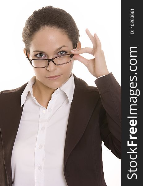 Young woman looking over the top of her glasses