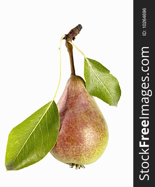 Fresh delicious pear with leafs. Isolated over white