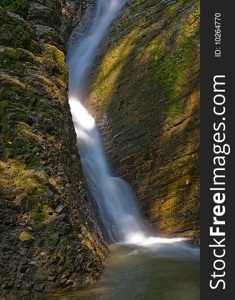 Fast water stream in brown stones