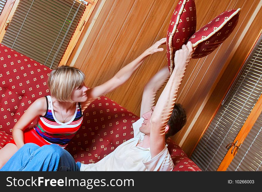 Couple Playing With Pillows