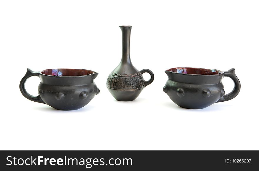 Two black decorative ceramic pots and small jug isolated on white