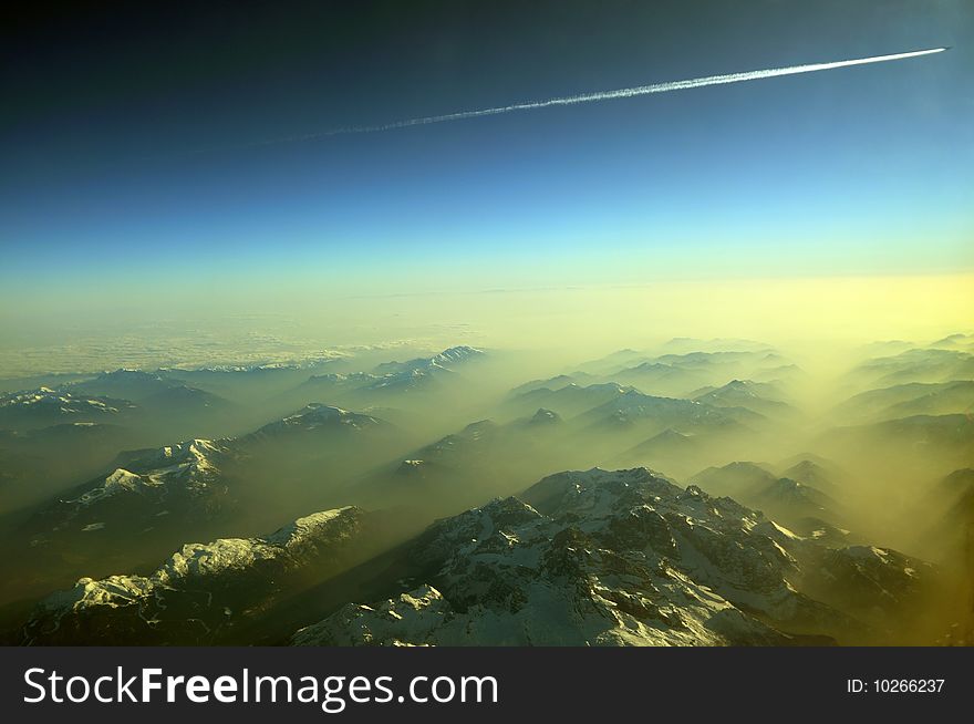 Flying over the Alps, sun and snow