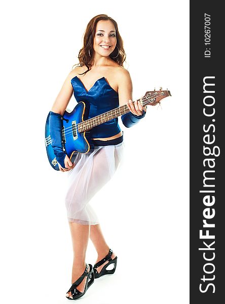 Portrait of a young brunette woman playing the guitar. Portrait of a young brunette woman playing the guitar