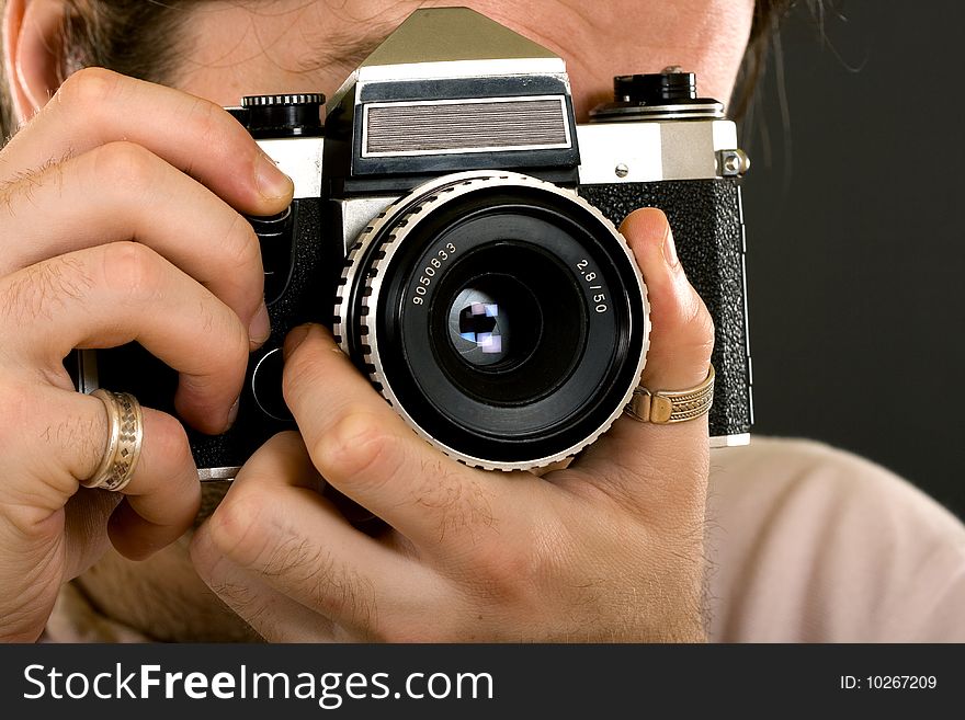 closeup of a classic photographer with an old film camera