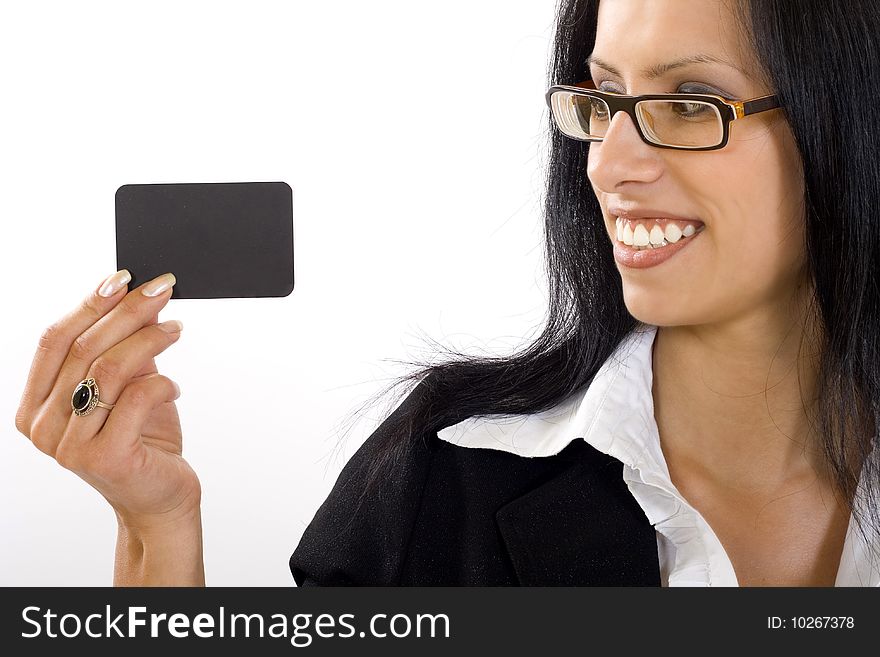 Closeup of an ttractive businesswoman holding and looking at a blank card. Closeup of an ttractive businesswoman holding and looking at a blank card