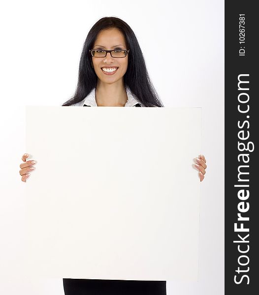 Attractive businesswoman holding a blank board