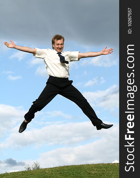 Happy jumping businessman in the air. Happy jumping businessman in the air