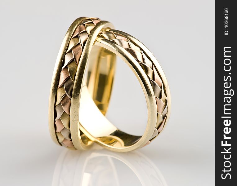 Gold wedding rings with reflexion
