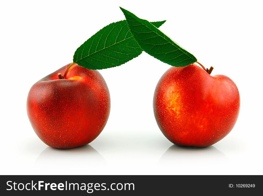 Ripe Peach (Nectarine) with Green Leafs Isolated on White Background