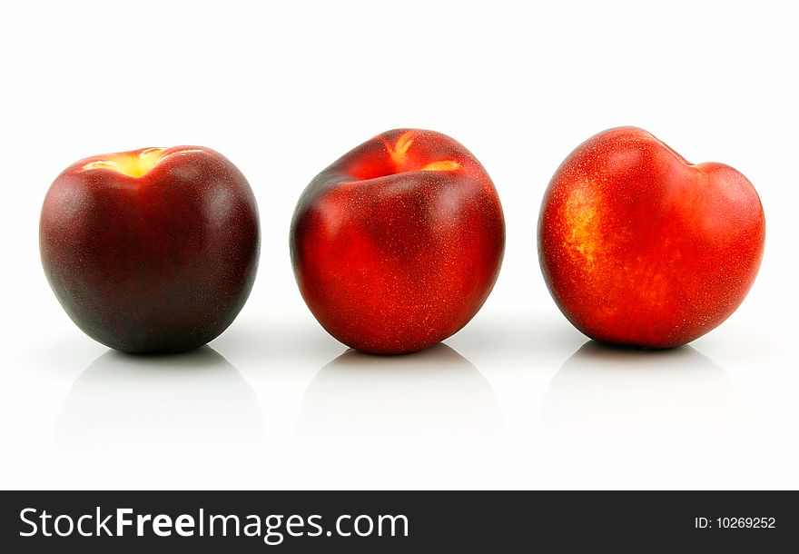 Three Ripe Peaches (Nectarine) Isolated on White Background