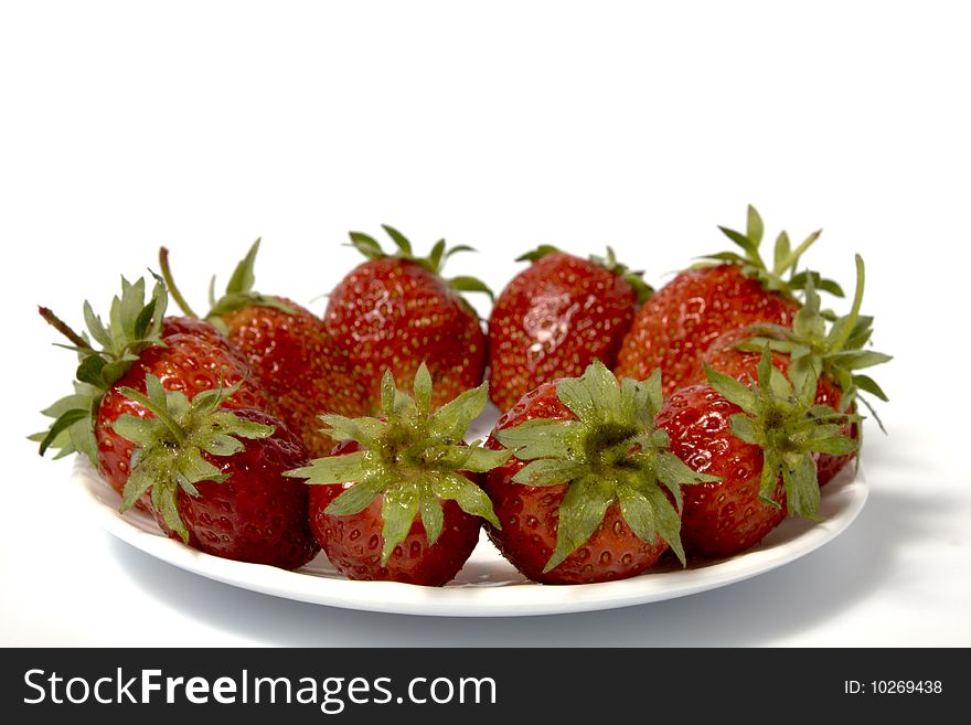 Fresh and tasty strawberries on white plate