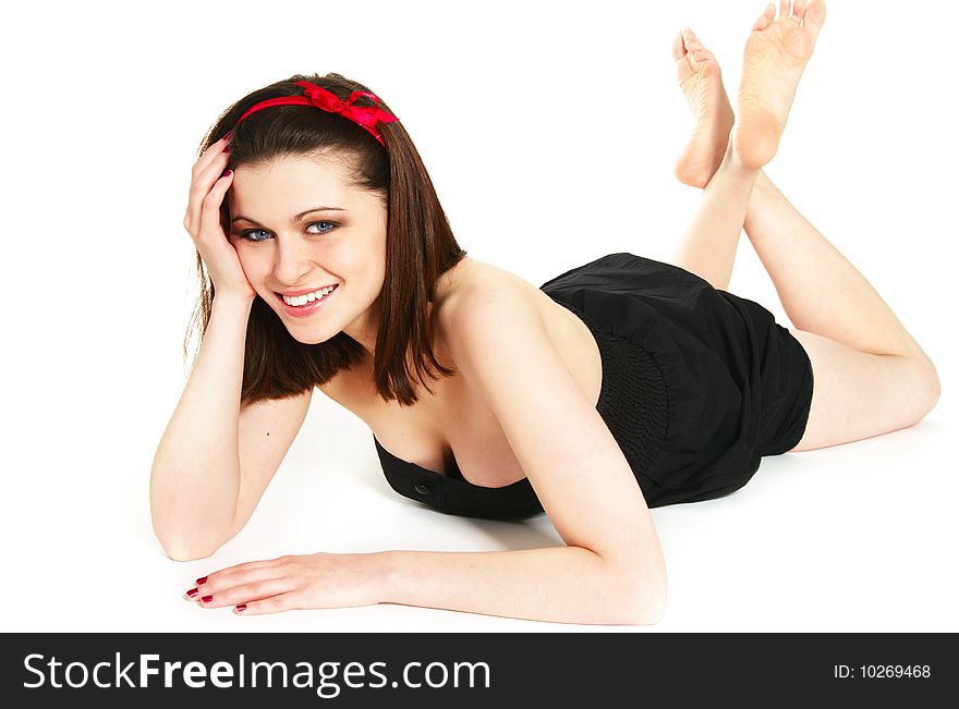 Smiling young beautiful girl lying on floor. Smiling young beautiful girl lying on floor