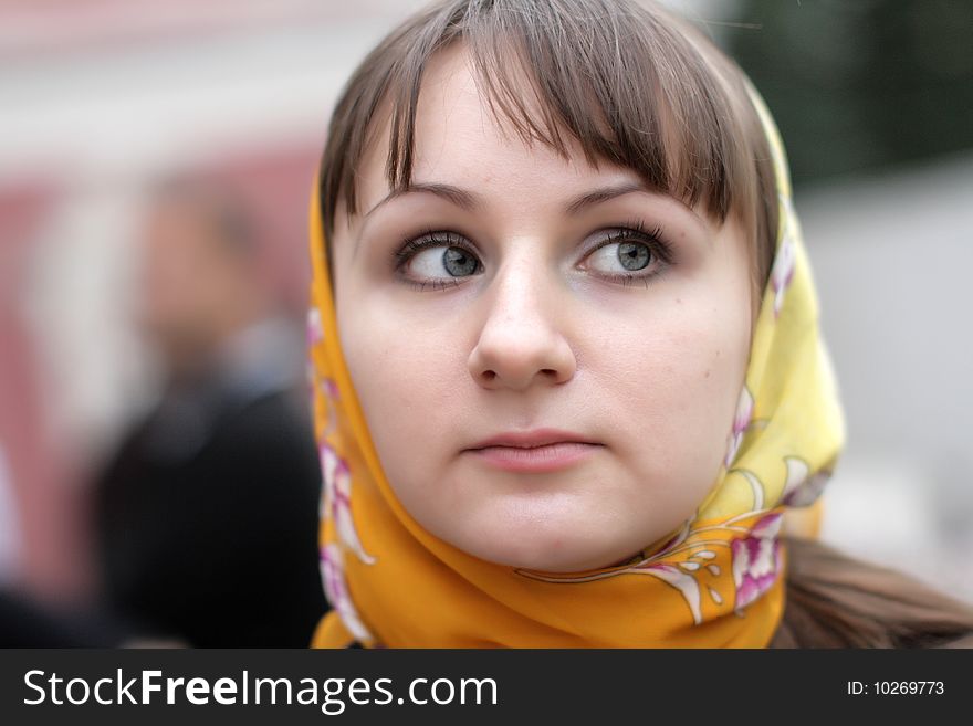 The young serious girl in kerchief, outdoor. The young serious girl in kerchief, outdoor