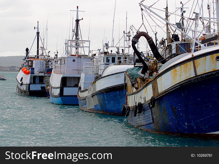 Fishing and lobster boats in Kalk Bay harbor, South Africa. Fishing and lobster boats in Kalk Bay harbor, South Africa