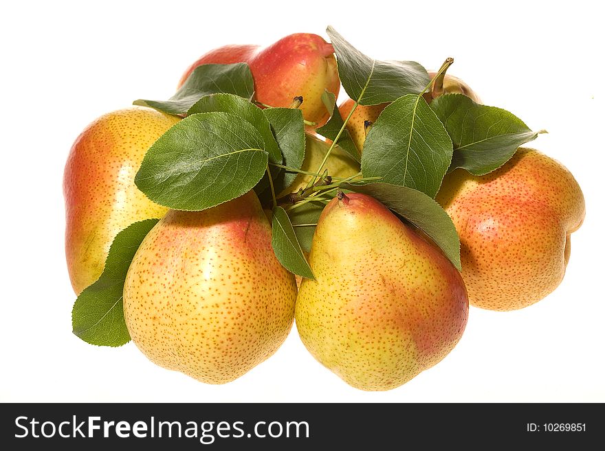 Pears with green leafs on white background