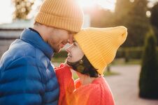 Romantic Young Couple Look At Each Other With Great Love, Have Nice Relationship, Going To Kiss, Have Walk Outdoor In Park, Wear W Royalty Free Stock Photography